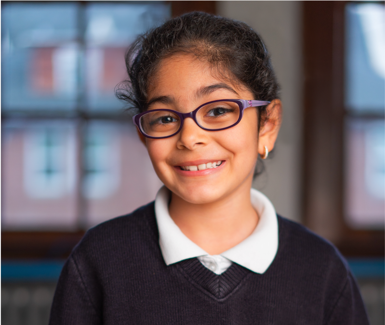 Girl student with glasses, smiling